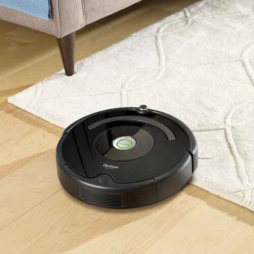 Roomba transitioning between surfaces